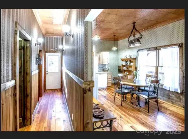 a living room with fireplace furniture and a flat screen tv