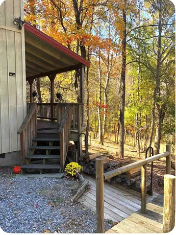 a view of a couches in the patio and a yard