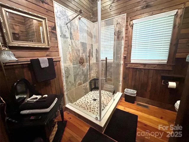 a living room with a couch and large window