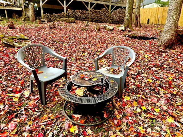a view of a backyard with sitting area