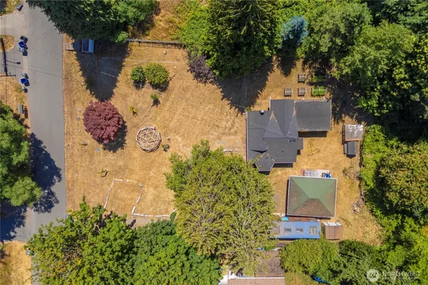 an aerial view of a house with a yard