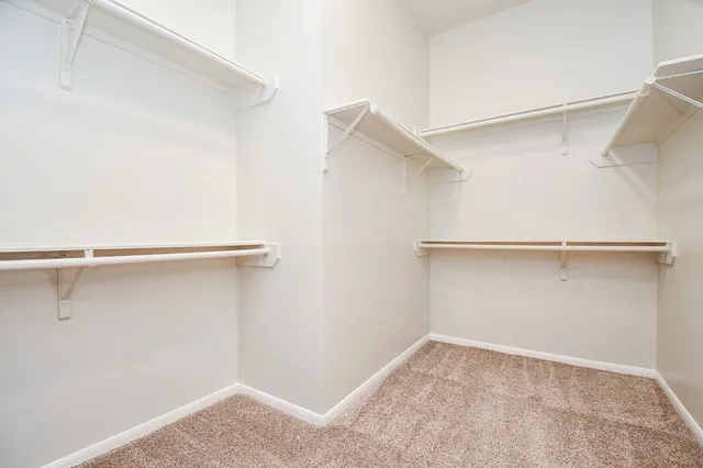 a view of an empty walk in closet