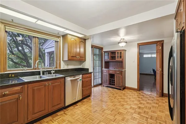 a kitchen with stainless steel appliances granite countertop a stove and a sink