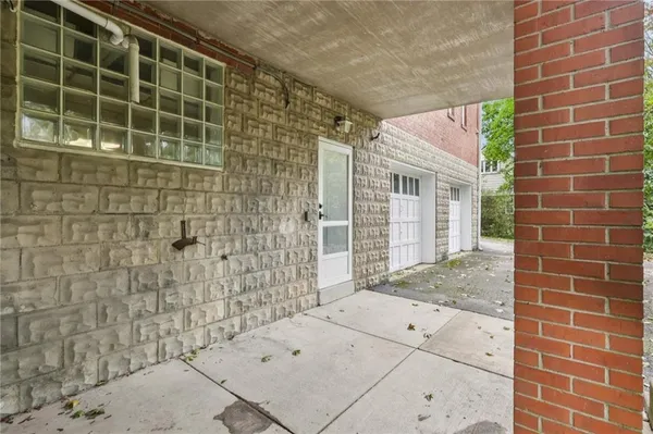a view of a brick house with a window