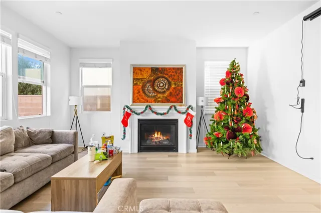a dining room with furniture and a potted plant