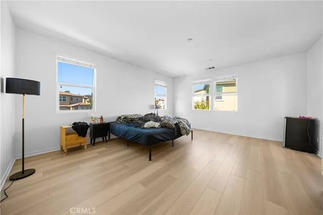 a bedroom with furniture and a window