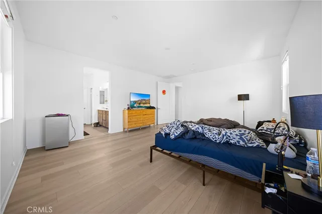 a bedroom with furniture and a window