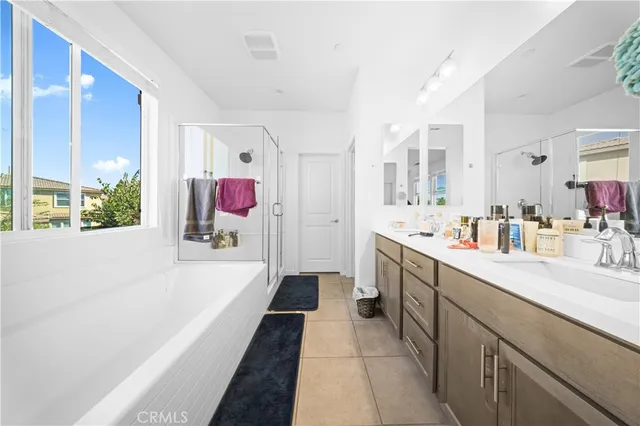 a white toilet sitting next to a white sink