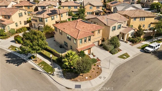 an aerial view of a house with swimming pool