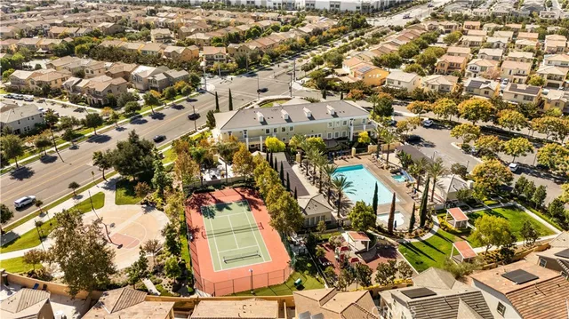 an aerial view of residential houses with outdoor space