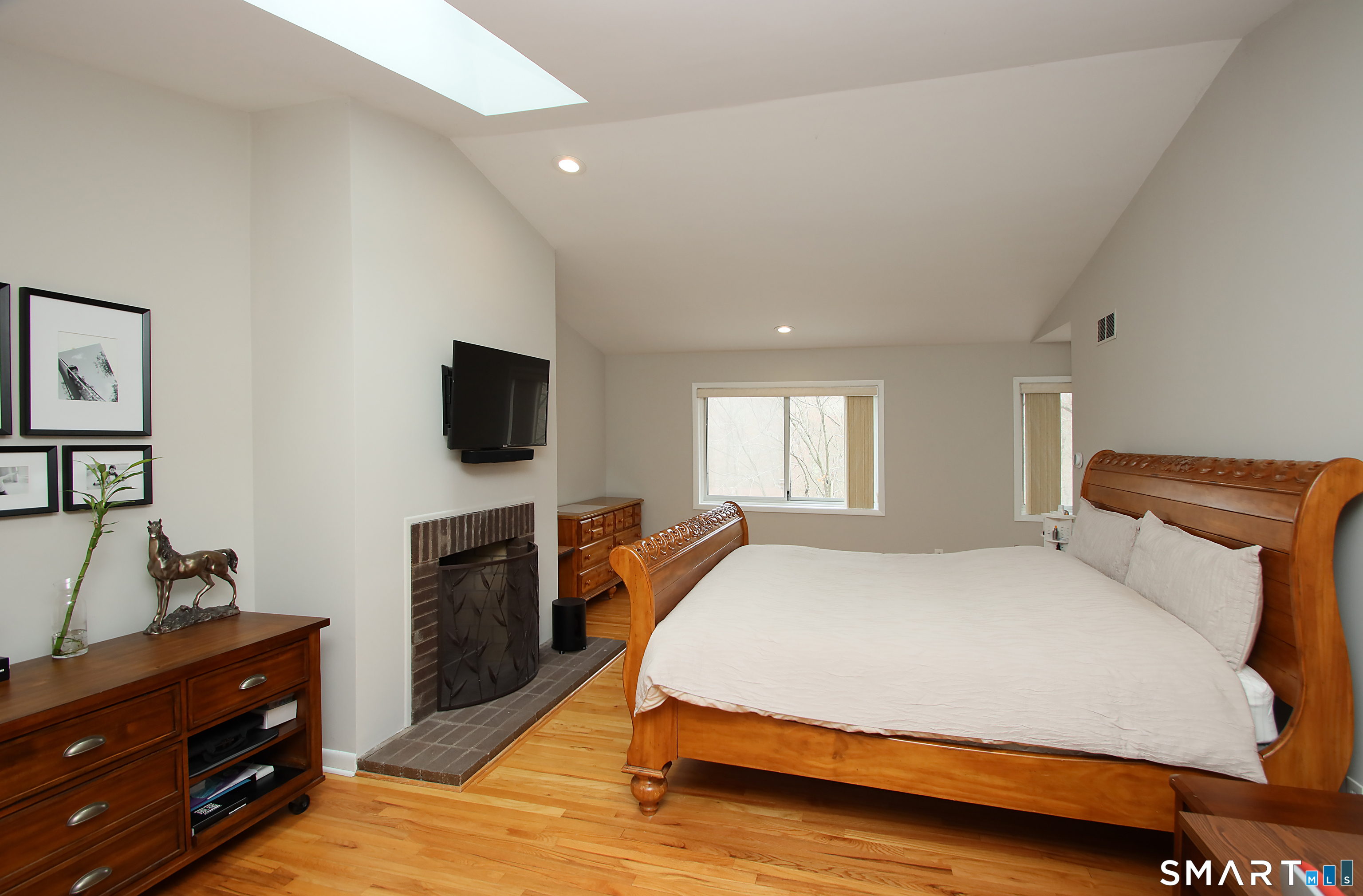 78 Sturbridge Road Easton, CT 06612 - Photo 19 of 35 a bedroom with a bed and a flat screen tv