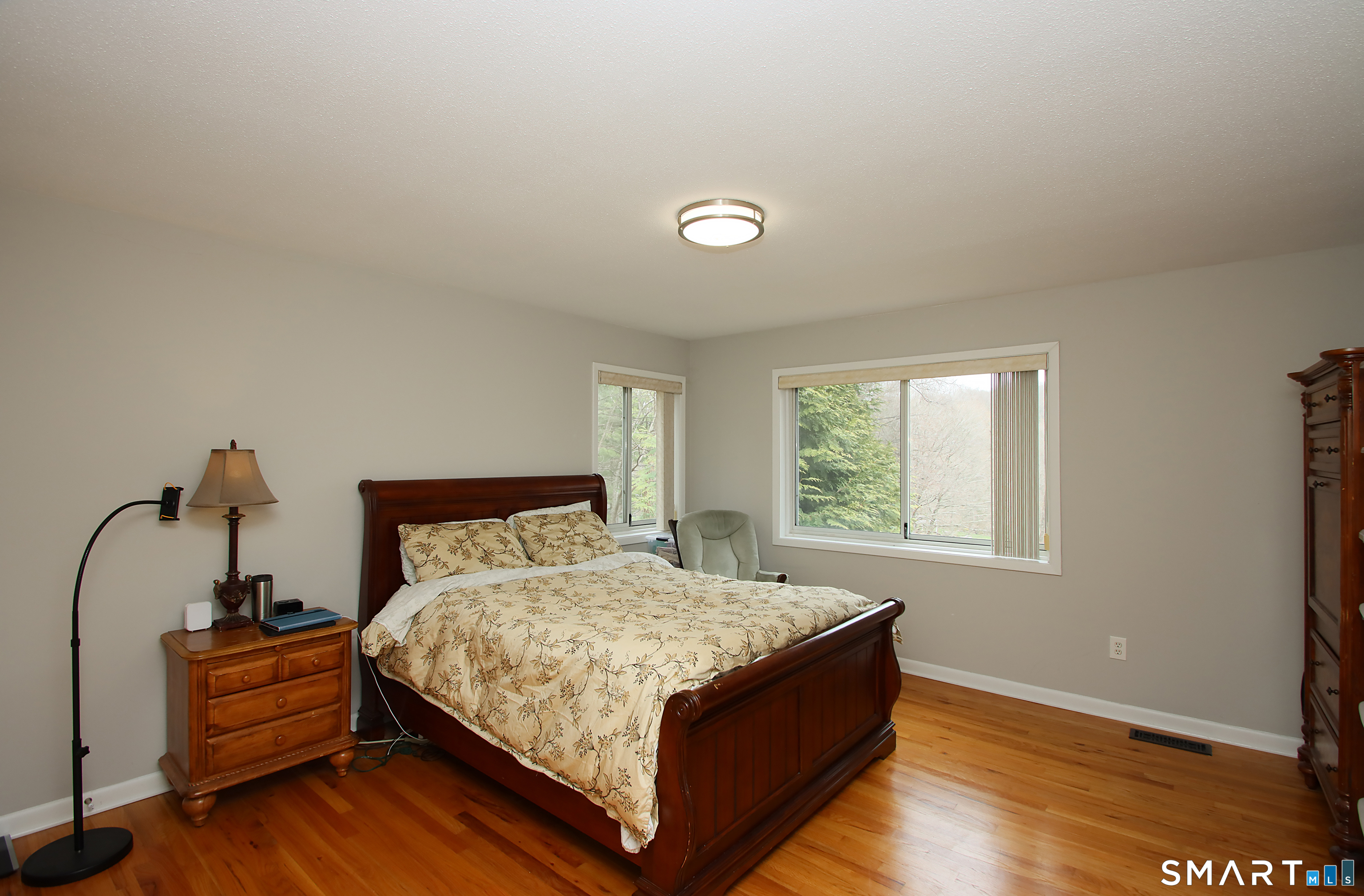 78 Sturbridge Road Easton, CT 06612 - Photo 25 of 35 a bed sitting in a bedroom next to a window