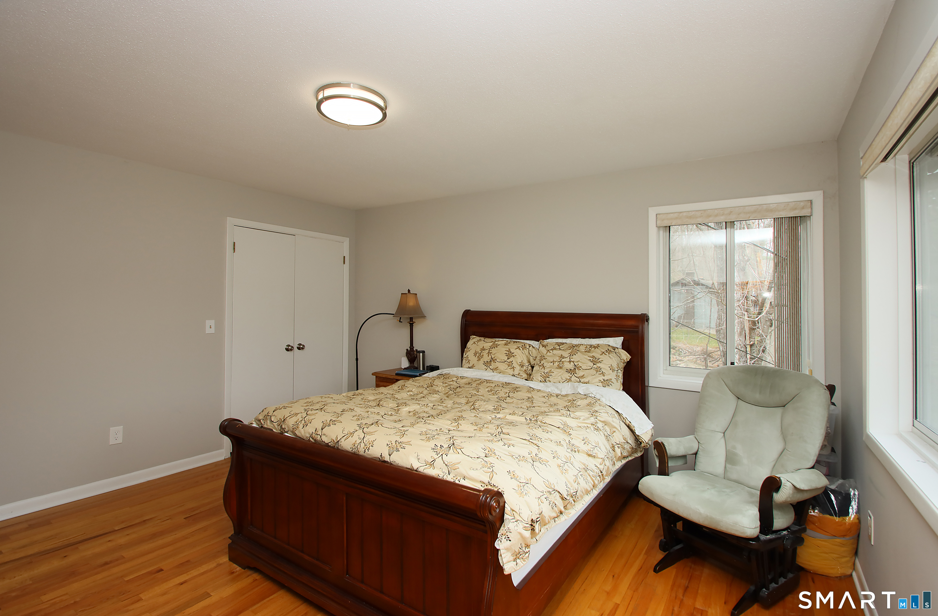 78 Sturbridge Road Easton, CT 06612 - Photo 26 of 35 a bedroom with a bed and wooden floor