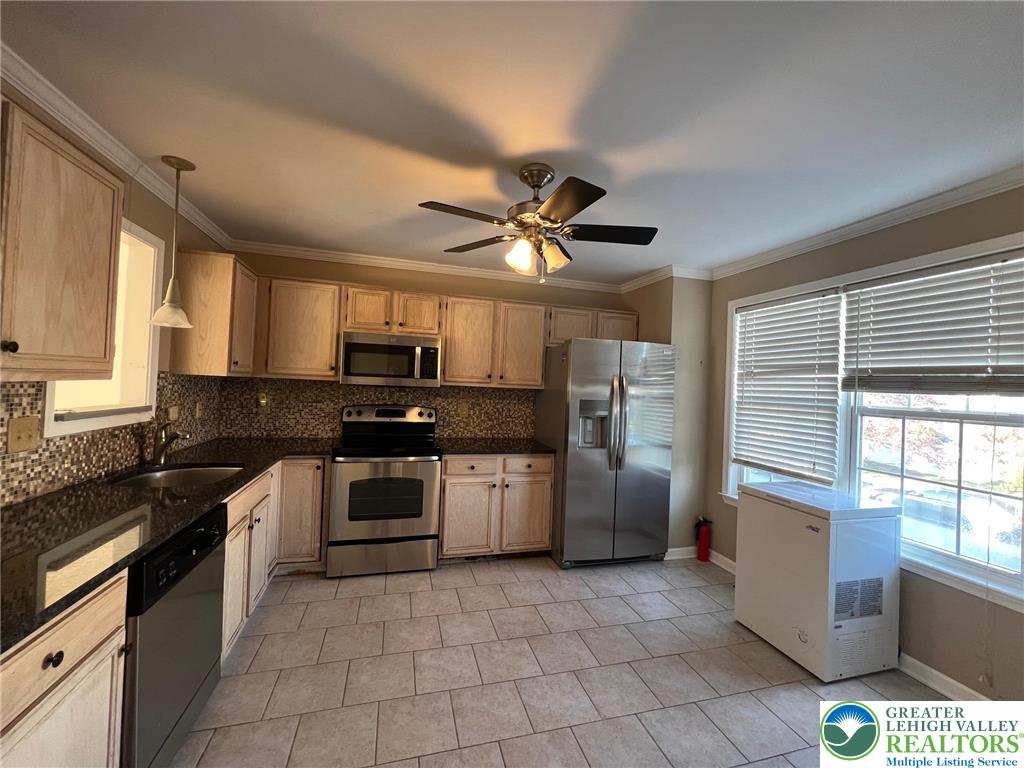 32 Corriere Road Easton, PA 18045 - Photo 3 of 14 a kitchen with a stove a sink and a microwave