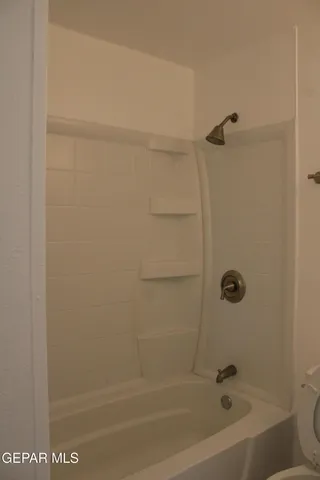 a view of a room that has a window in it