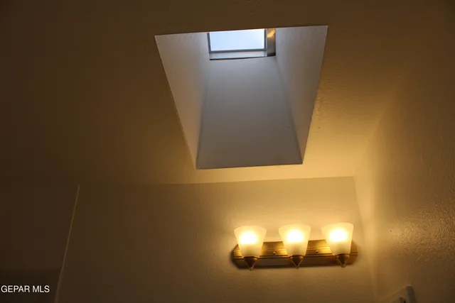 a view of a room that has a window in it