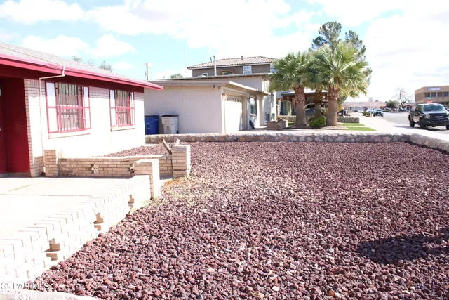 a view of a backyard of the house
