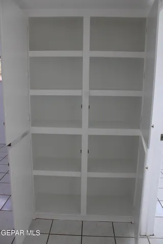 a backyard of a house with barbeque oven