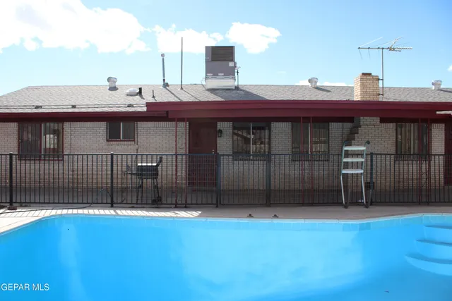 a view of a chairs and table in patio