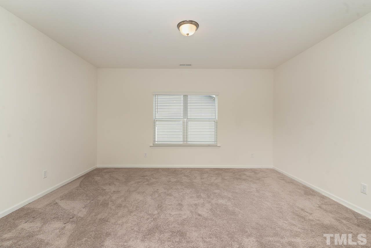 6809 Shane Drive Raleigh, NC 27610 - Photo 18 of 21 an empty room with windows