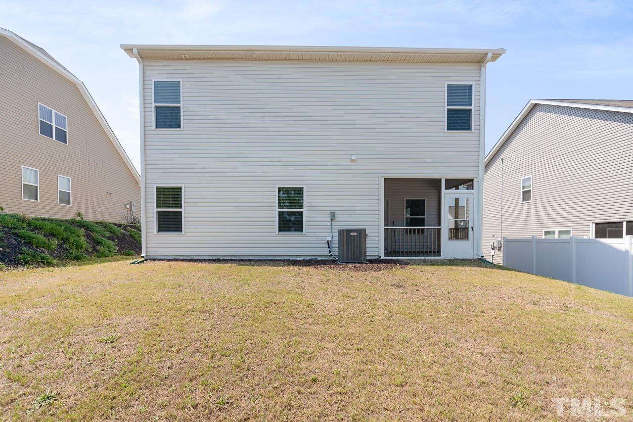 6809 Shane Drive Raleigh, NC 27610 - Photo 3 of 21 a view of an house with backyard and a tree