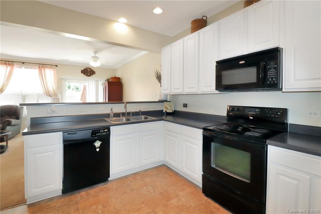 615 Potter Place Road Fort Mill, SC 29708 - Photo 8 of 25 a kitchen with a sink stove and microwave