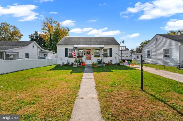 a view of a house with swimming pool and a yard