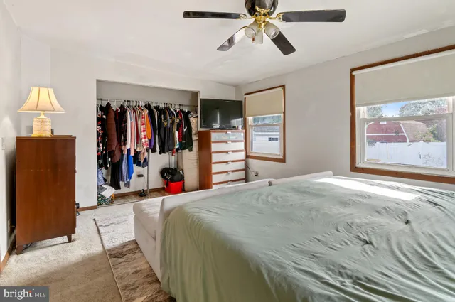 a bed room with a bed and a walk in closet