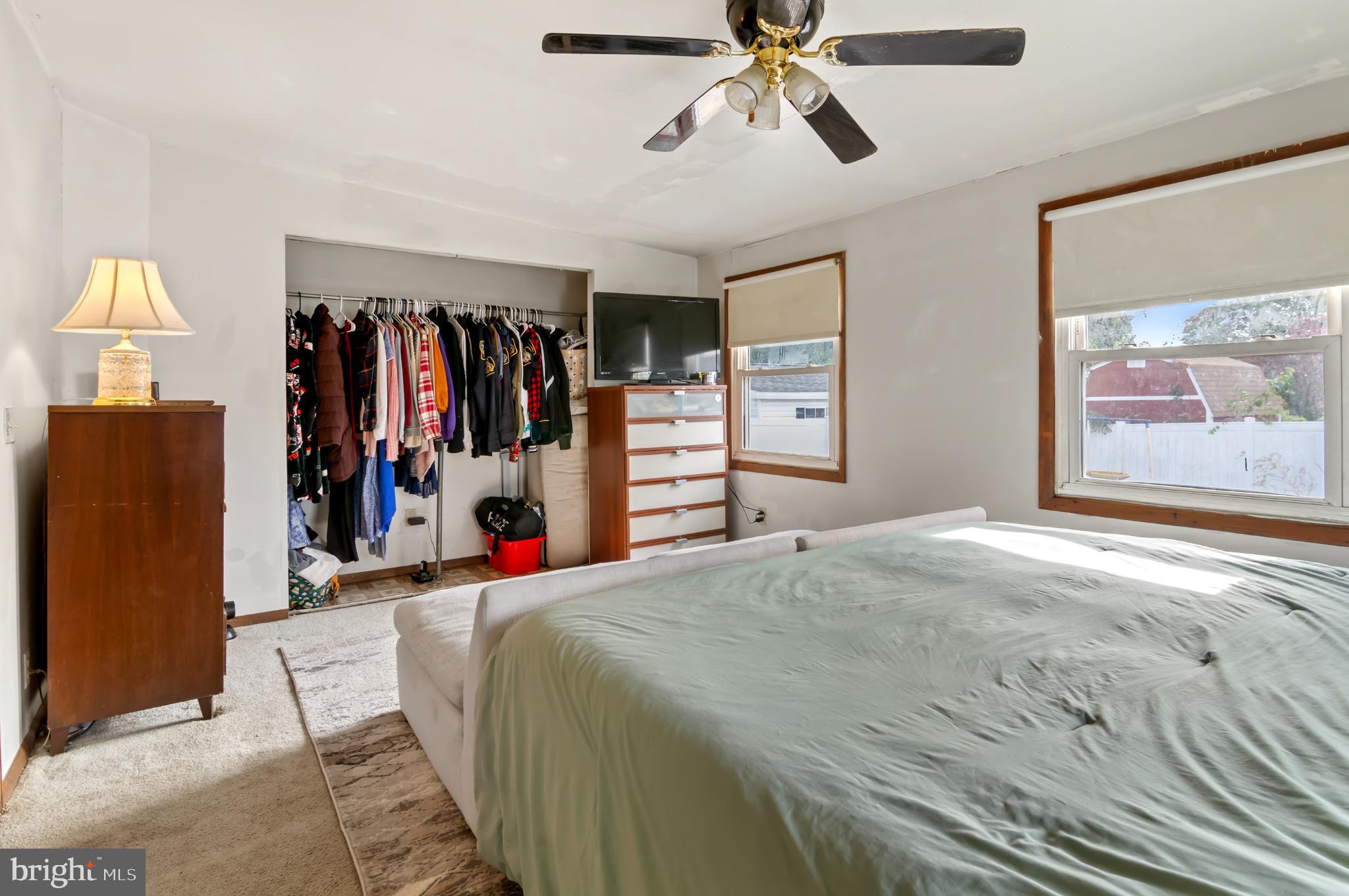 3 Compression Court Middle River, MD 21220 - Photo 17 of 27 a bed room with a bed and a walk in closet