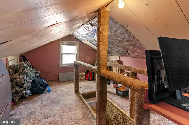 a view of a livingroom with furniture and a flat screen tv