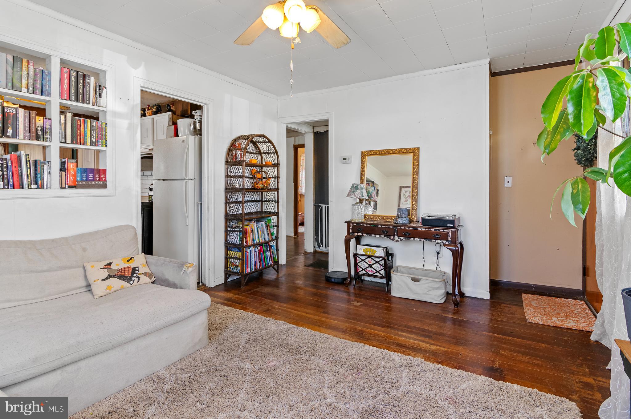 3 Compression Court Middle River, MD 21220 - Photo 2 of 27 a living room with furniture and a book shelf