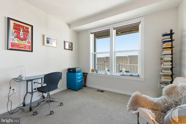 a work room with furniture and windows