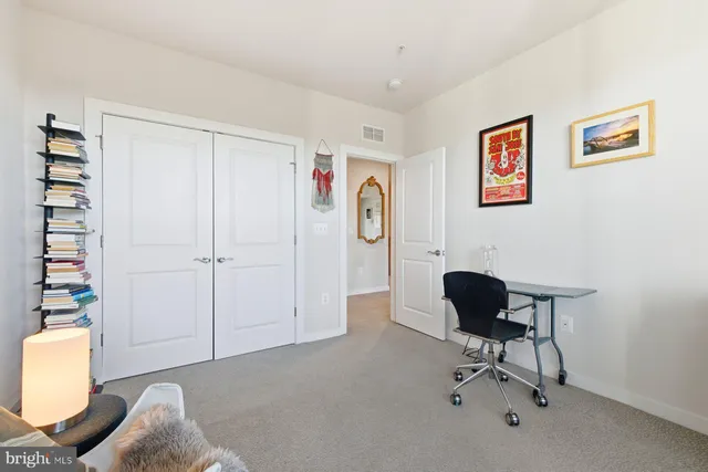 a living room with furniture and a chair