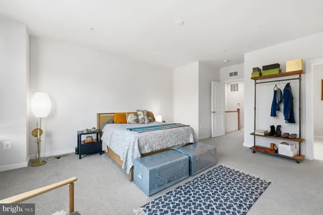 a bedroom with a bed and gym equipment