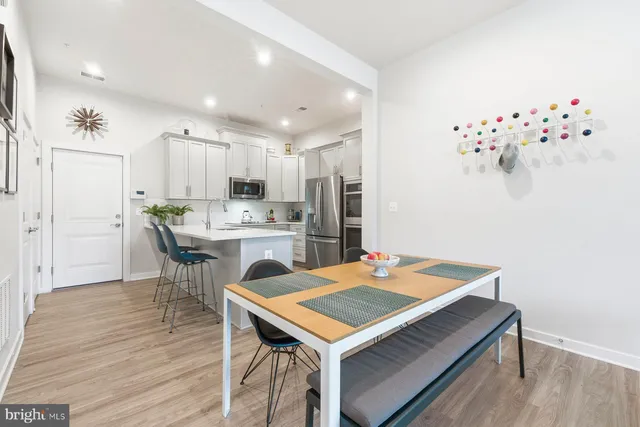 a kitchen with a table and chairs