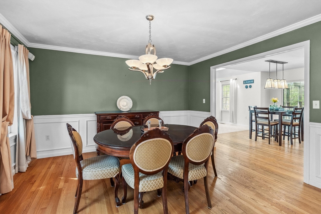 10 Falls Brook Road Hudson, MA 01749 - Photo 16 of 42 a dining room with furniture a chandelier and wooden floor
