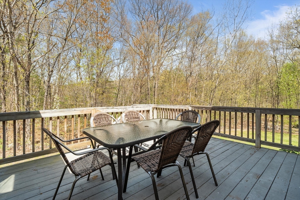 10 Falls Brook Road Hudson, MA 01749 - Photo 22 of 42 a view of balcony with furniture and wooden floor