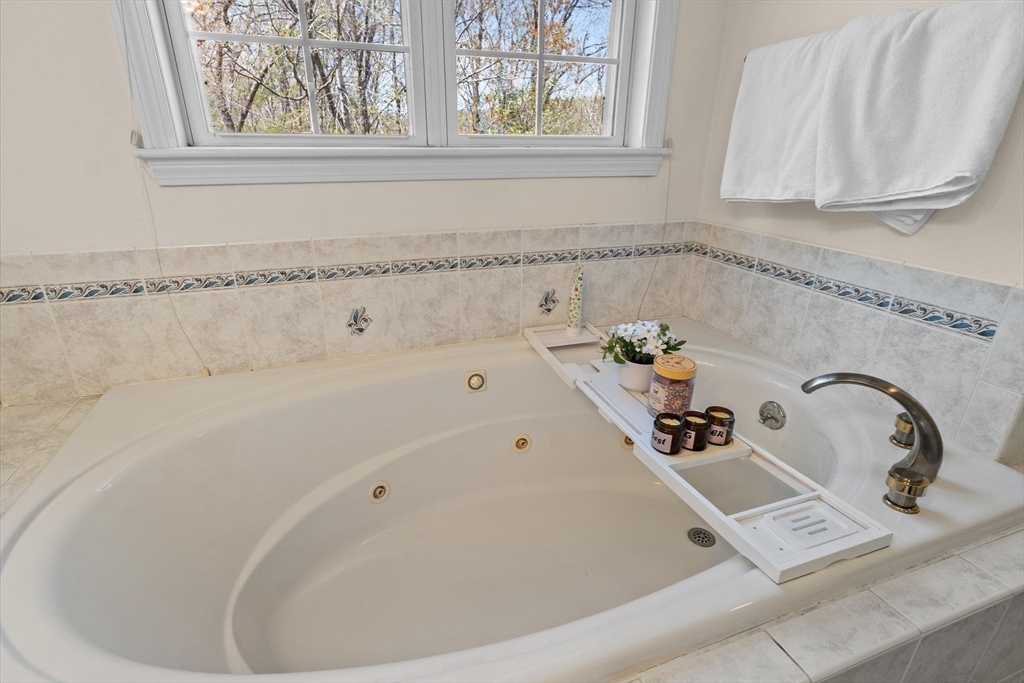 10 Falls Brook Road Hudson, MA 01749 - Photo 30 of 42 a bathroom with a bathtub and a sink