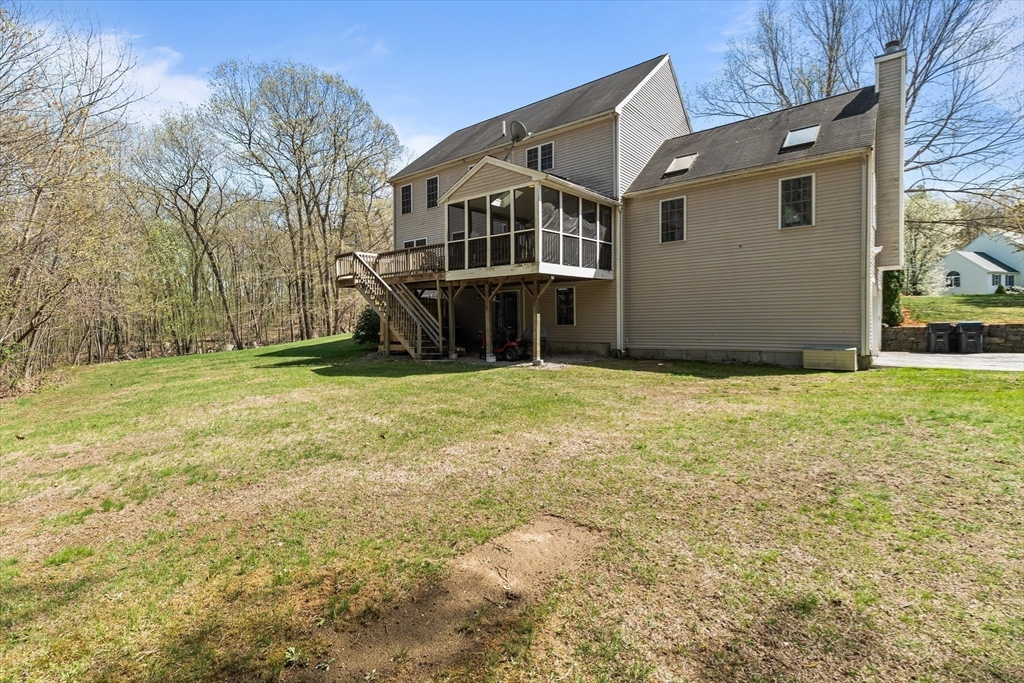 10 Falls Brook Road Hudson, MA 01749 - Photo 38 of 42 a view of a house with a yard