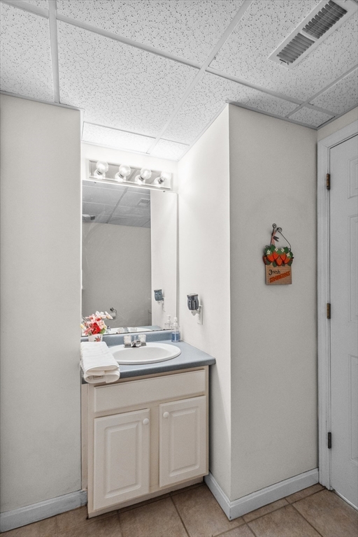 10 Falls Brook Road Hudson, MA 01749 - Photo 10 of 42 a bathroom with a sink vanity and a mirror