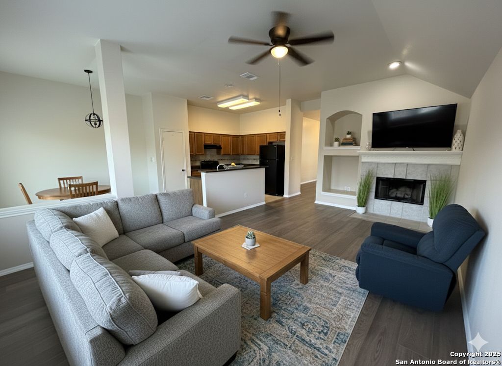 8346 Copperglen Converse, TX 78109 - Photo 3 of 15 a living room with furniture fireplace and flat screen tv