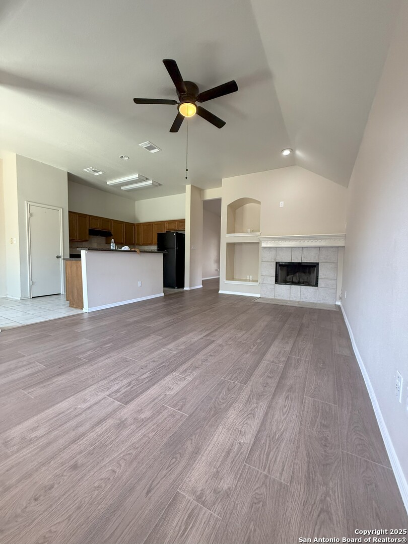 8346 Copperglen Converse, TX 78109 - Photo 7 of 15 a view of empty room with wooden floor and ceiling fan