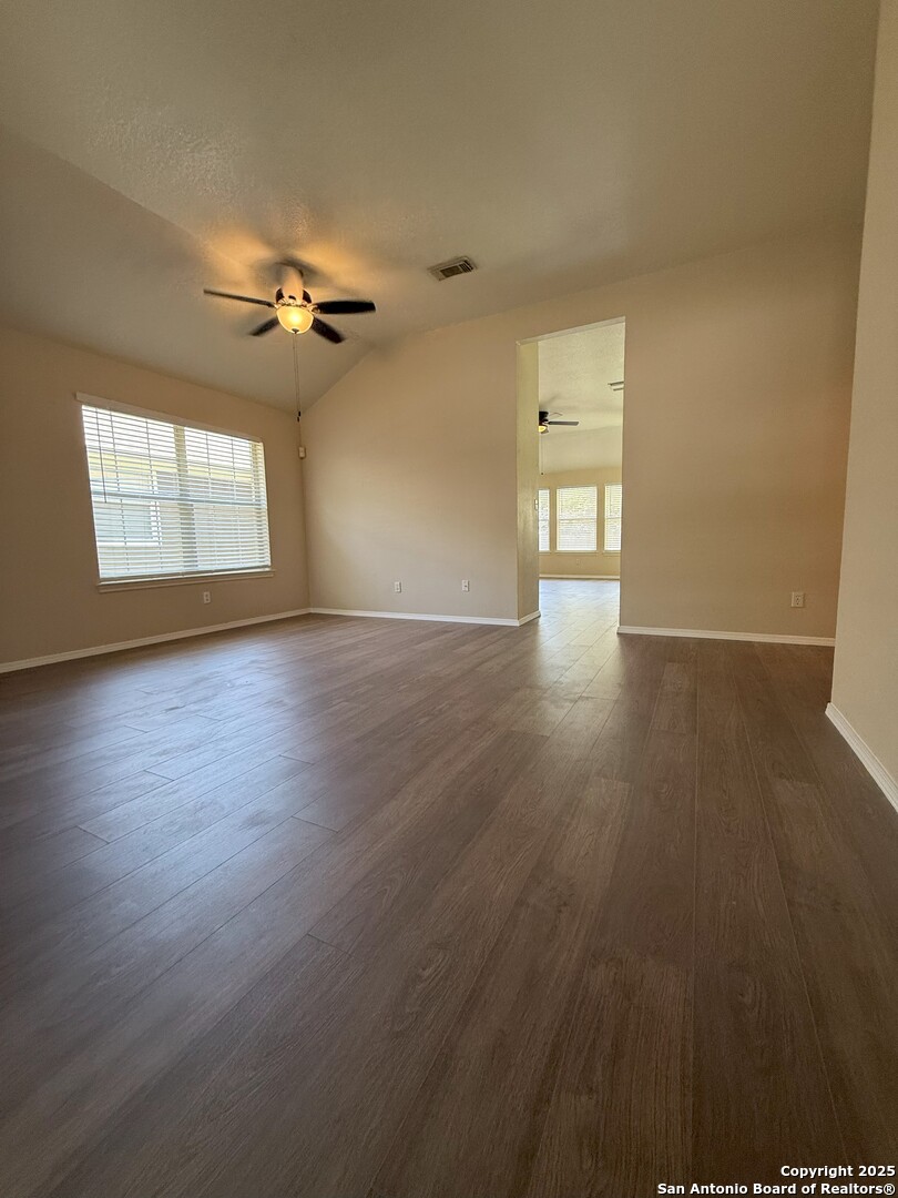 8346 Copperglen Converse, TX 78109 - Photo 9 of 15 a view of empty room with wooden floor and fan