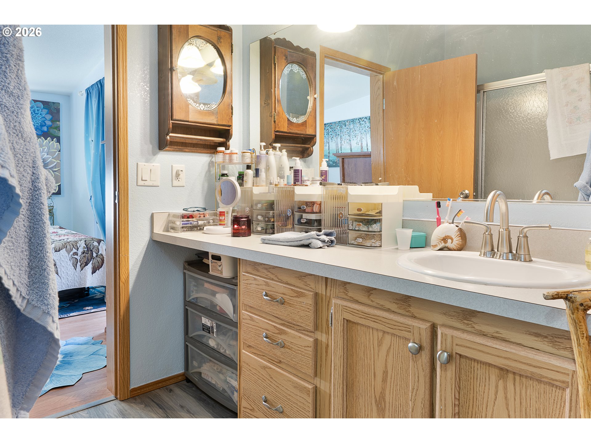 96465 Coverdell Road, Unit 8 Brookings, OR 97415 - Photo 5 of 16 a bathroom with a sink mirror and vanity