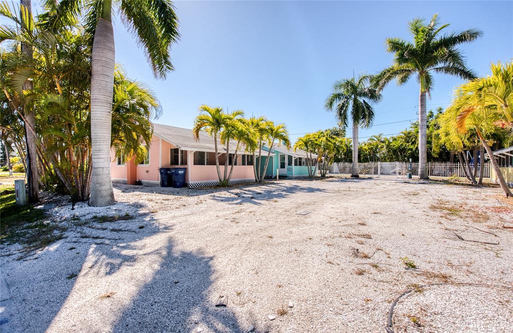 13136 4th Street East Madeira Beach, FL 33708 - Photo 12 of 75 a view of a yard with a tree
