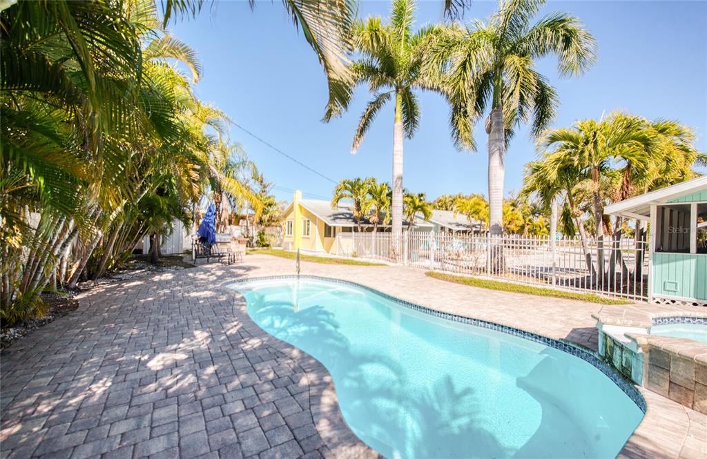 13136 4th Street East Madeira Beach, FL 33708 - Photo 23 of 75 a view of a swimming pool with a patio