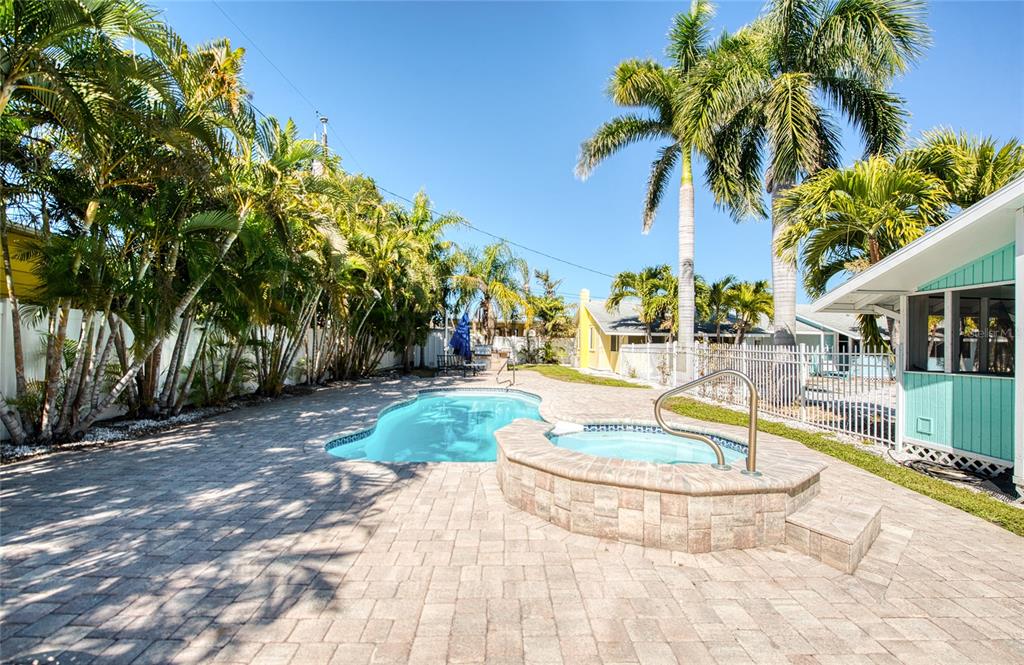 13136 4th Street East Madeira Beach, FL 33708 - Photo 27 of 75 a view of a swimming pool with a patio
