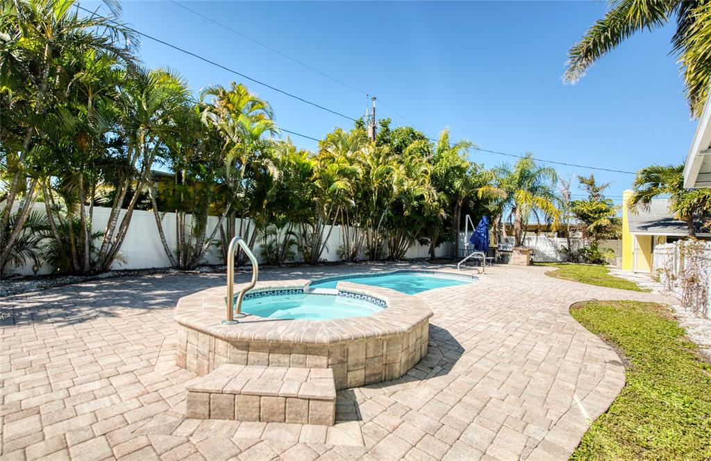 13136 4th Street East Madeira Beach, FL 33708 - Photo 28 of 75 a view of a swimming pool with a patio