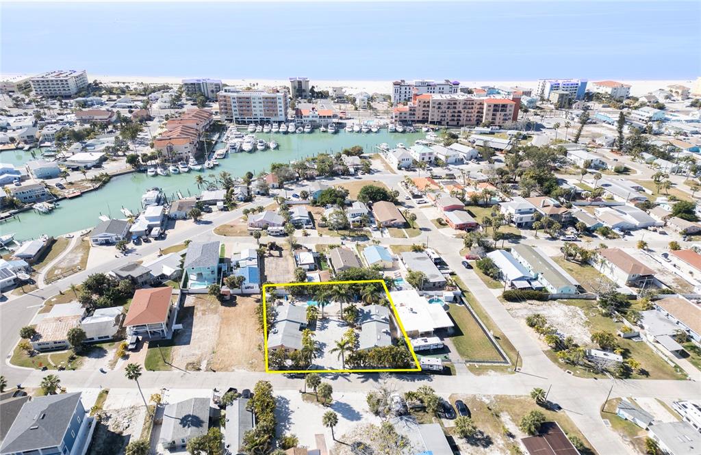 13136 4th Street East Madeira Beach, FL 33708 - Photo 3 of 75 an aerial view of residential houses with city view