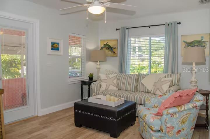 13136 4th Street East Madeira Beach, FL 33708 - Photo 39 of 75 a living room with furniture and a window